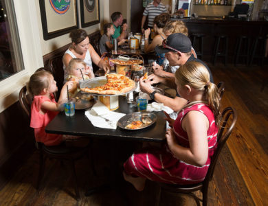 Family dining at Roberto's Italian Pizzeria Sports Bar in Destin, Florida